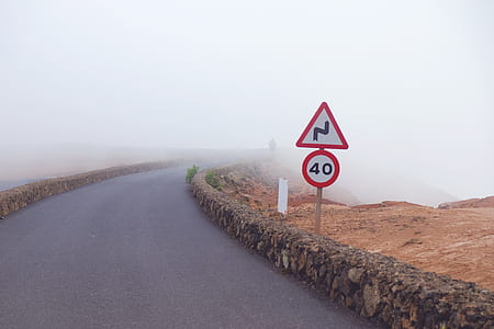 red and white traffic signage beside road thumbnail