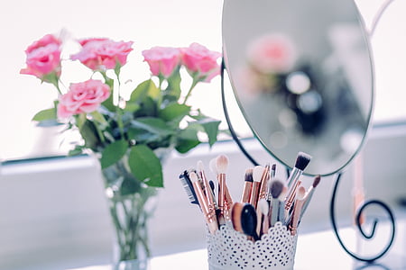 selective focus photography of pink rose in vase thumbnail