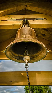 low-angle photography of gold-colored bell thumbnail