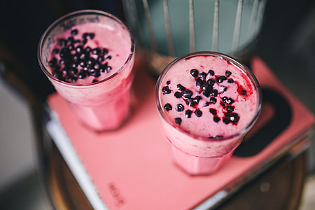 Girl holding blueberry yoghurt thumbnail