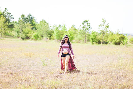Maternity Photo Shoot of Woman Wearing Slit Front Dress thumbnail