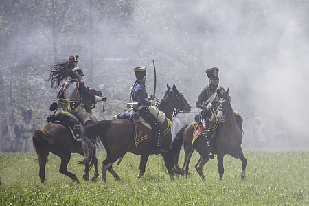 three men holding sword riding horses thumbnail
