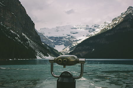 boat on body of water and view of mountain thumbnail