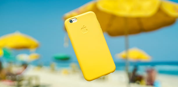 silver iPhone 7 with yellow iPhone case on air thumbnail