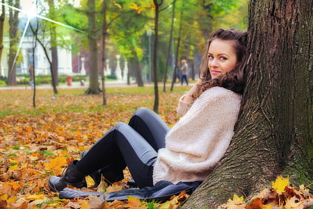 woman sitting on tree roots at daytime thumbnail