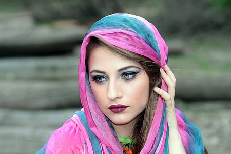 selective focus photography of woman wearing pink and blue hijab veil thumbnail