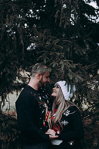 couples under pine tree photo thumbnail