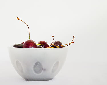 clear glass bowl filled with cherries thumbnail