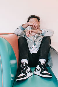 man sitting on couch thumbnail