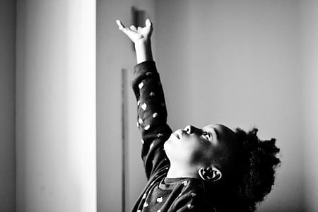 grayscale photo of child wearing sweatshirt thumbnail