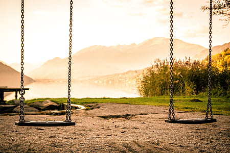 two black steel swings thumbnail