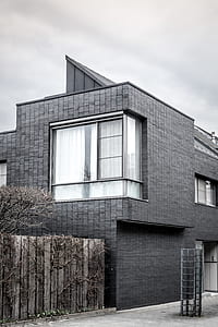 grey house with wooden fence thumbnail