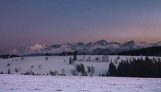 snow covered mountain under blue sky thumbnail