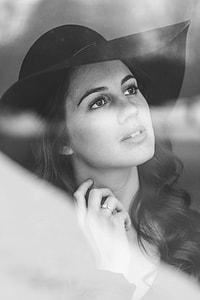 woman wearing ring and hat looking towards right thumbnail