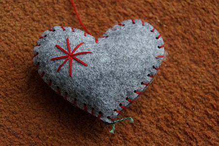 gray and red heart decor on brown surface thumbnail