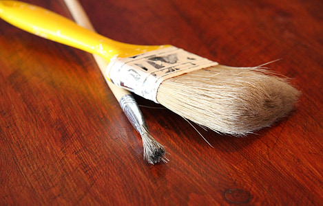 selective focus photography of two yellow paint brushes thumbnail