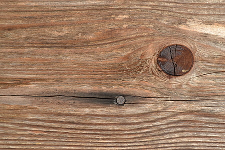 brown wooden board with gray metal nail thumbnail