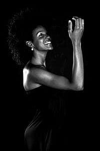Grayscale Photo of Smiling Woman Wearing Dress thumbnail