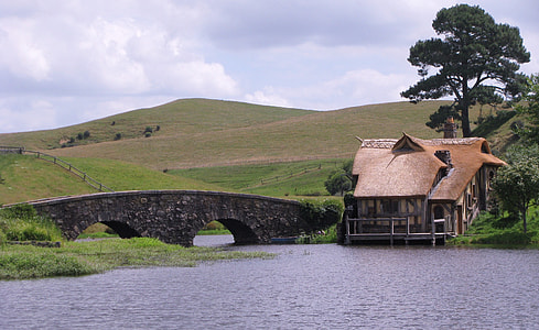 brown house beside gray bridge thumbnail