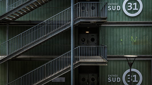 empty gray metal stairs at daytime thumbnail