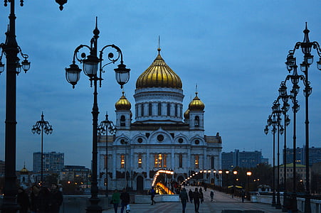 people walking near white building thumbnail