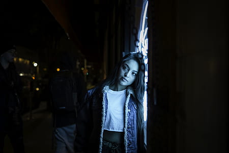 woman in white crew-neck crop top and blue denim jacket thumbnail