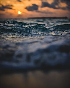 depth of field photography of ocean waves thumbnail