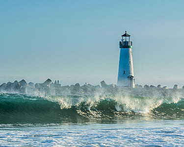 lighthouse near body of water thumbnail