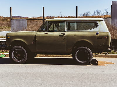 Classic Beige and White Sports Utility Vehicle on Road thumbnail