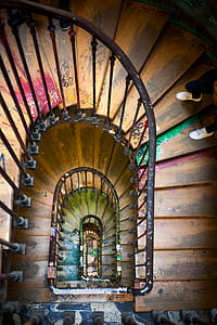 person standing on spiral helix staircase thumbnail