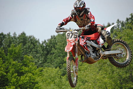 man riding motocross dirt bike thumbnail
