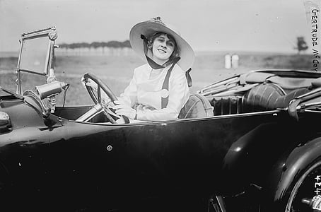 grayscale photography of woman riding convertible thumbnail