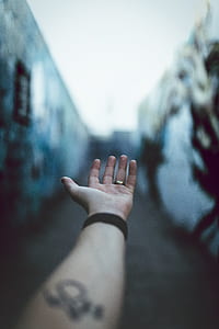 person wearing silver-colored ring thumbnail