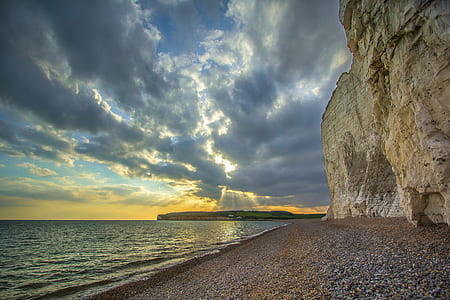 Beige and Grey Rock on the Seashore Photograph thumbnail