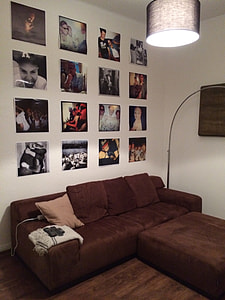 portrait paintings on white wall in room thumbnail