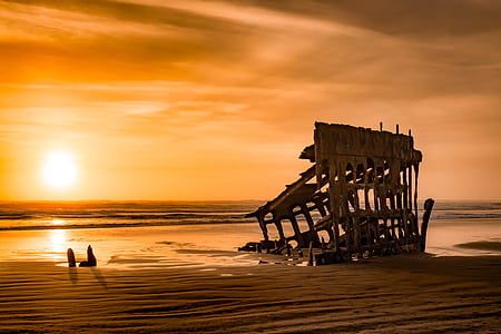 brown house on seashore during golden hour thumbnail