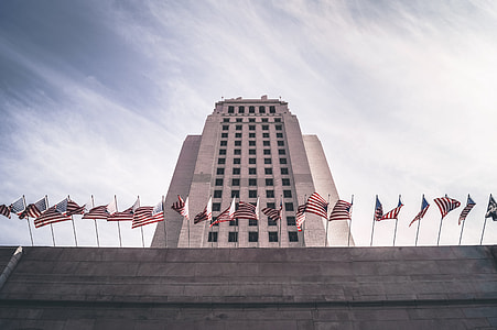 white concrete building under blue sky during daytime thumbnail