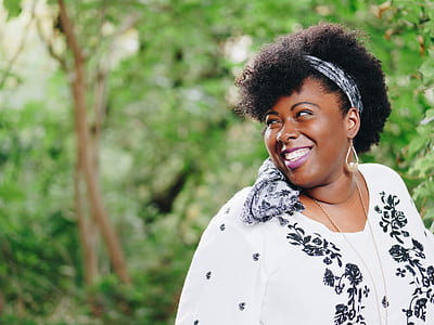 woman smiling while looking to her right thumbnail