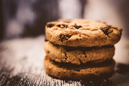 selective photo of three brown cookies on gray board thumbnail