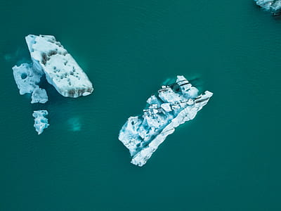 two white ice formation on body of water thumbnail
