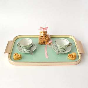 cookies and two teacups on tray thumbnail