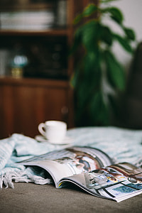 Resting with magazine and cute puppy thumbnail