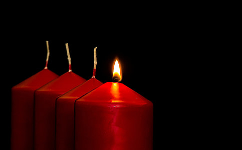 four red pillar candles one is lighten up thumbnail