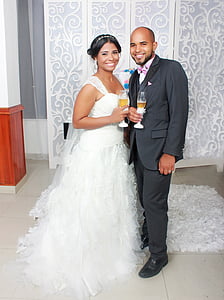 newly wed bride and groom smiling next to each other thumbnail