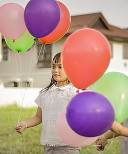 Photography of a Girl Holding Balloons thumbnail