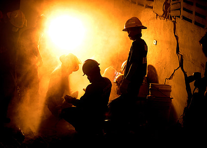 silhouette photo of miners thumbnail