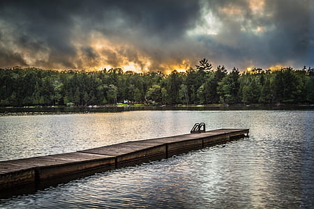 brown wooden dock in lake thumbnail
