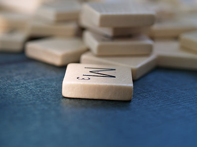 selective focus photography of a M3 scrabble chip thumbnail