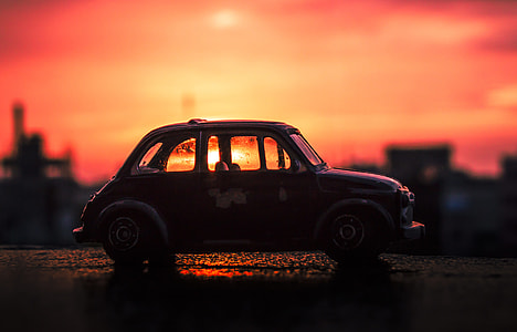 red car during dawn thumbnail