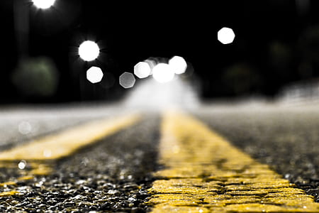 bokeh photography of asphalt road thumbnail